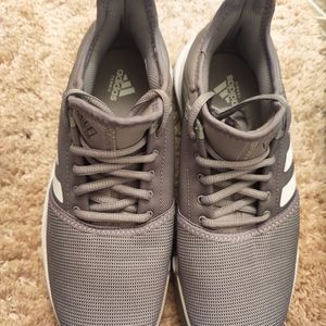 New grey, never wore men's size 9 game court Adidas tennis shoes.